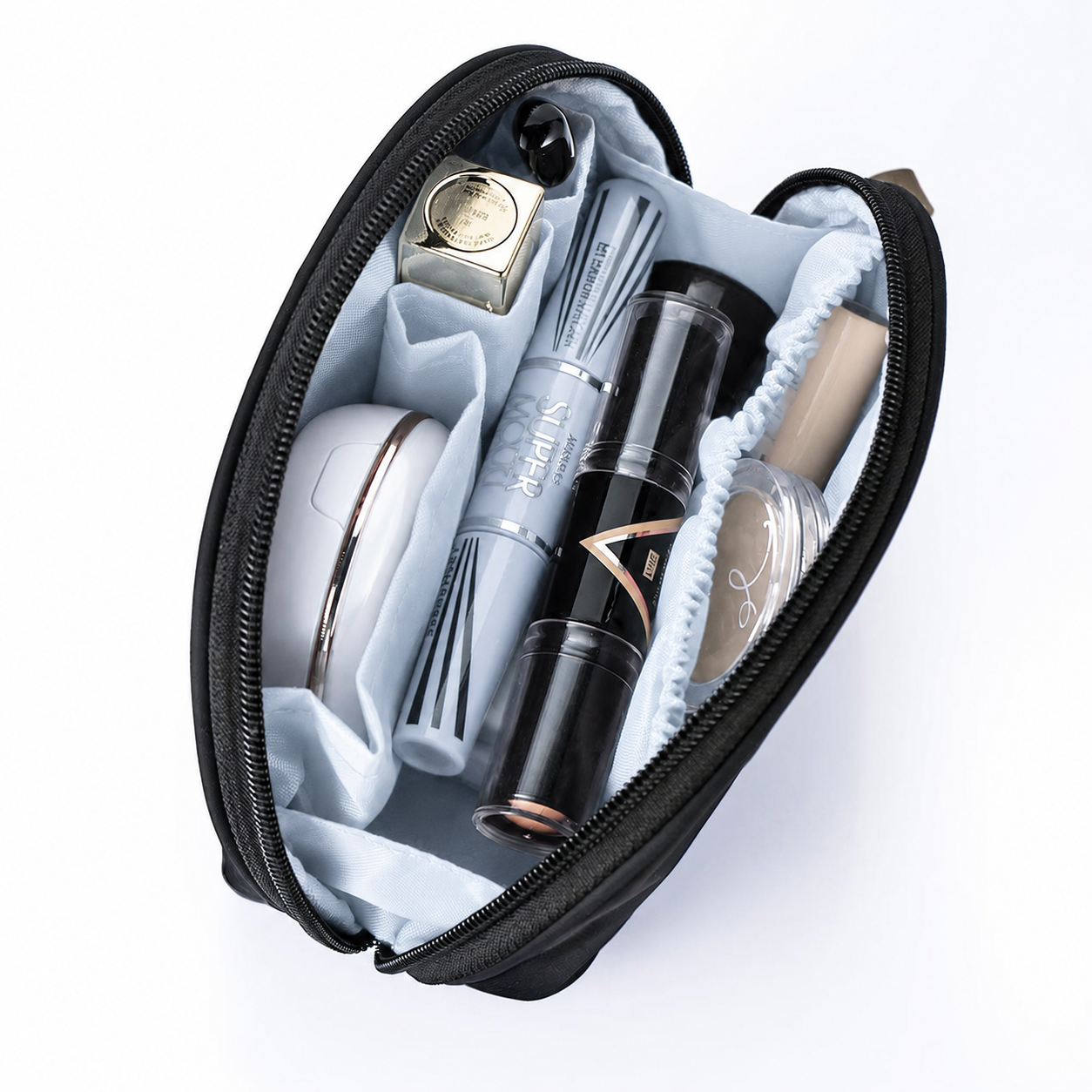 Makeup bag CARA with cosmetic products including a brush and bottles on a white background