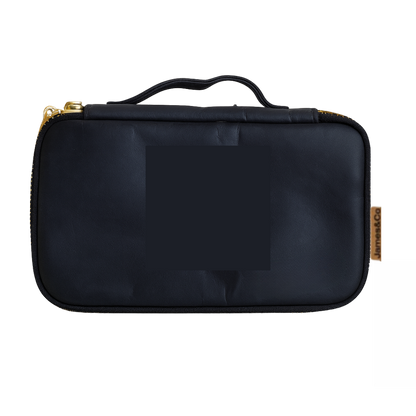Black travel case with gold zipper on a white background