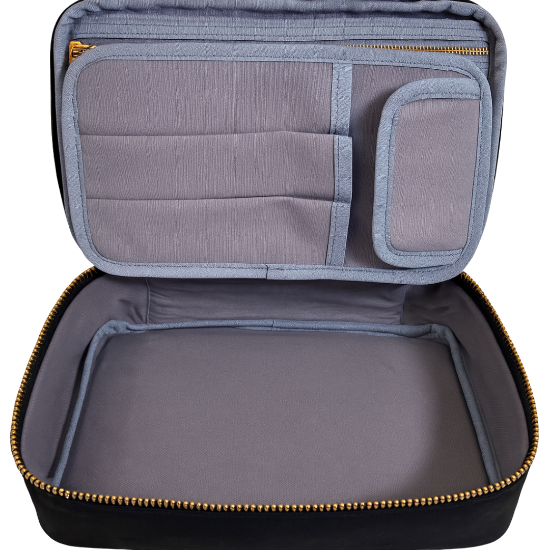 Open travel case with compartments on a white background